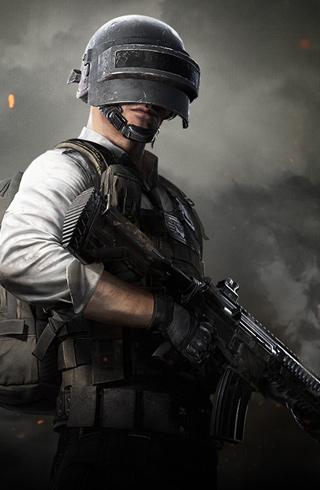 PUBG Royale Rumble - An image of a man in SWAT gear carrying a gun. He is wearing a helmet with a visor covering his eyes.